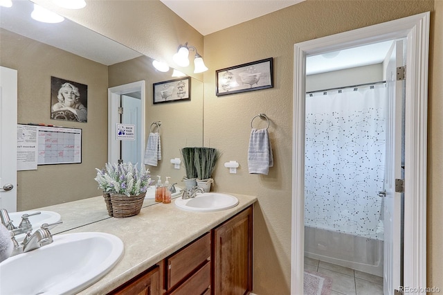 9994 Quintero St, Commerce City, CO 80022 - bathroom with double vanity, tile patterned flooring, shower / bath combination with curtain, and a textured wall