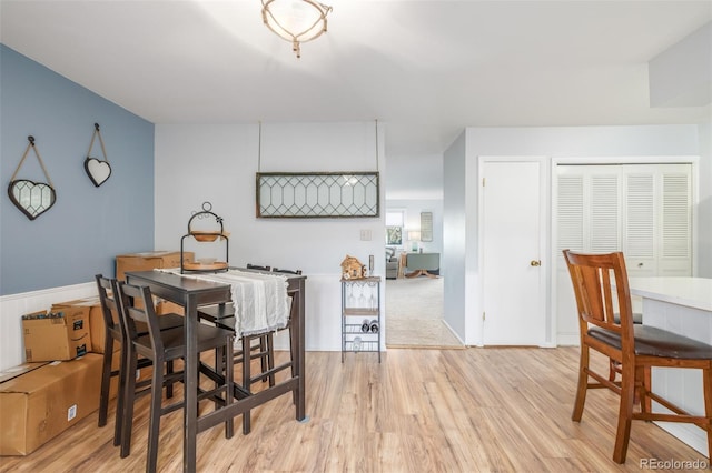 dining space with light wood-type flooring