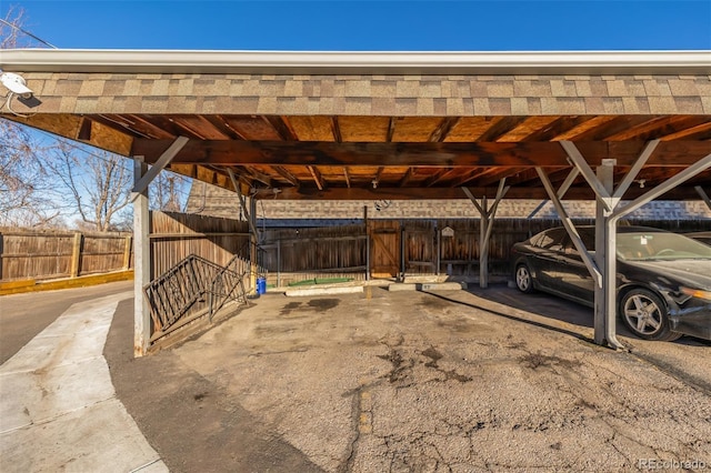 covered parking lot with fence