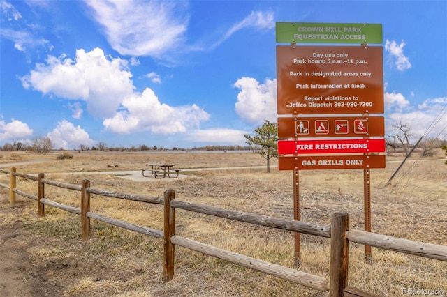 exterior space featuring a rural view and fence