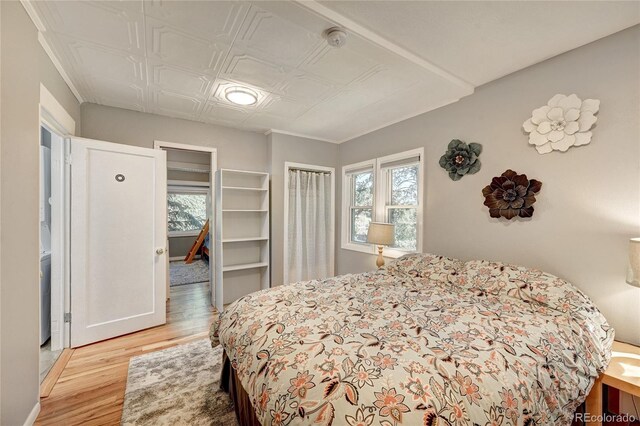 4642 Plettner Ln, Evergreen, CO 80439 - bedroom with light wood-style floors and an ornate ceiling