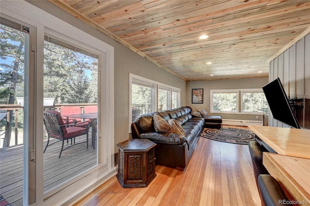 4642 Plettner Ln, Evergreen, CO 80439 - living area featuring wooden ceiling, a baseboard heating unit, light wood-style flooring, healthy amount of natural light, and recessed lighting