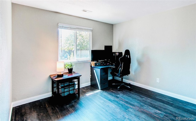 home office featuring dark wood-style floors and baseboards