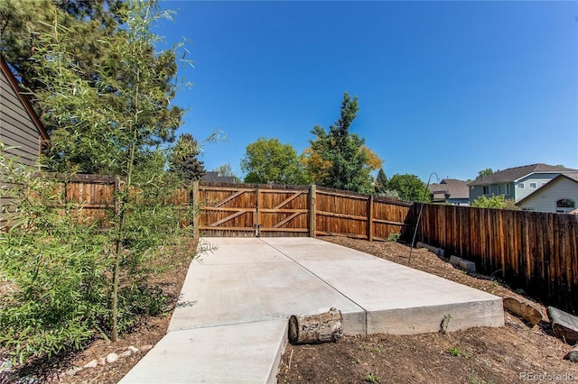 view of patio with a fenced backyard and a gate