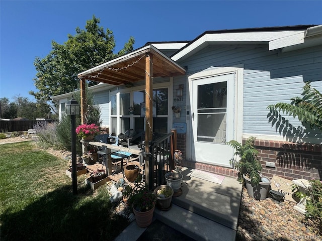 rear view of property with a yard