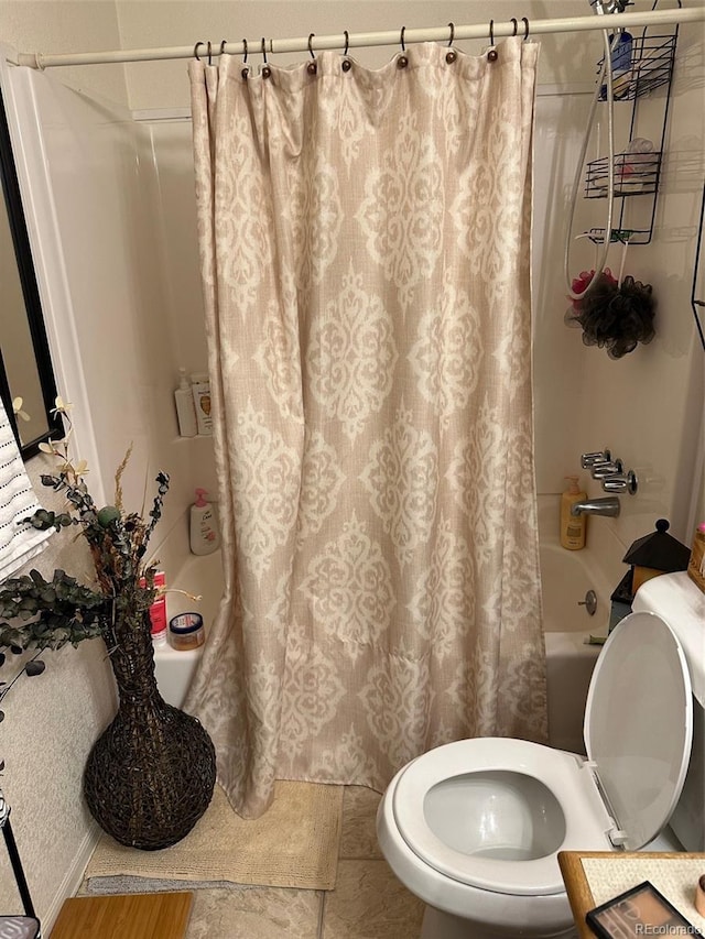 bathroom featuring toilet and shower / bathtub combination with curtain