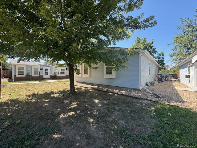 back of house with a yard