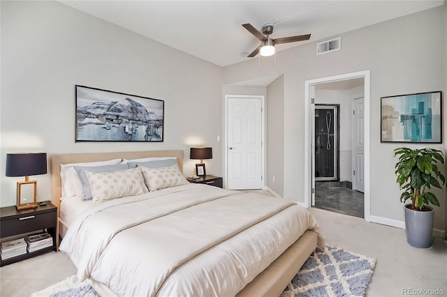 bedroom featuring ceiling fan, ensuite bathroom, light carpet, visible vents, and baseboards