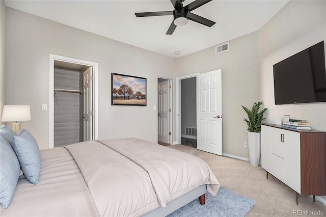 bedroom with baseboards, ceiling fan, visible vents, and light colored carpet