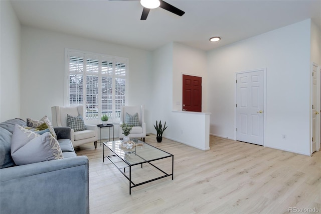 living area with recessed lighting, ceiling fan, baseboards, and wood finished floors