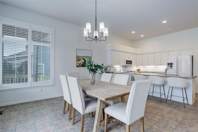 dining area with recessed lighting, visible vents, a notable chandelier, and baseboards