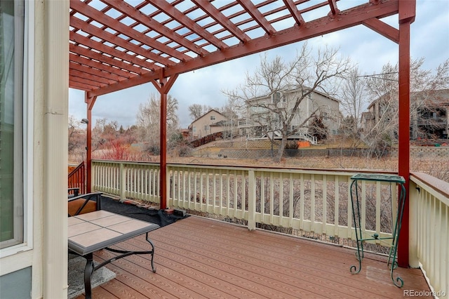 wooden deck with a residential view and a pergola