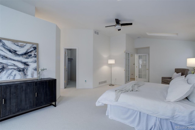 carpeted bedroom with a ceiling fan, lofted ceiling, french doors, and visible vents