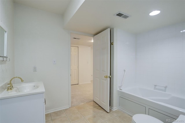 bathroom with a bathtub, visible vents, vanity, tile patterned flooring, and baseboards