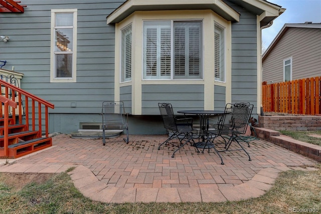 view of patio / terrace featuring fence