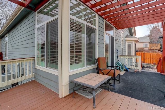 deck with fence and a pergola