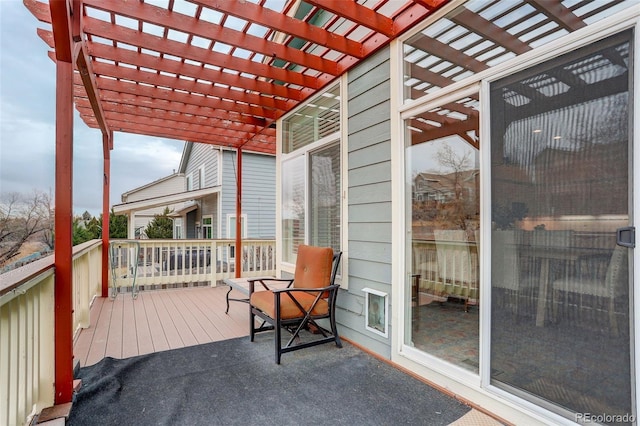 wooden terrace with a pergola