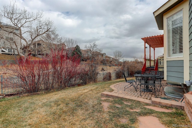 view of yard featuring fence, a pergola, and a patio