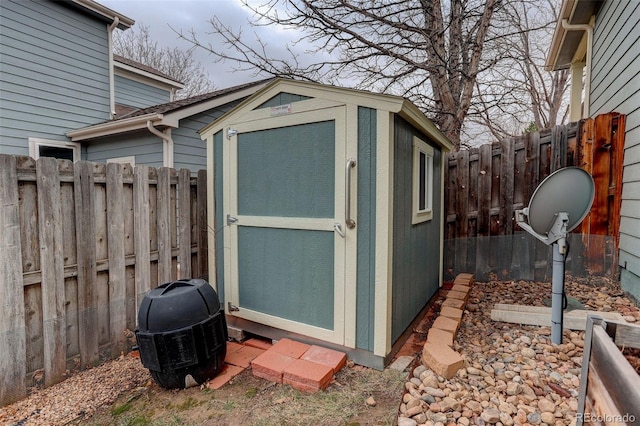 view of shed with a fenced backyard