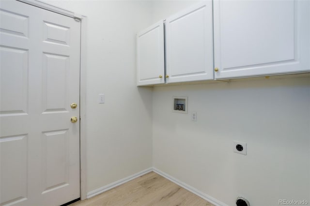 washroom featuring cabinet space, baseboards, light wood-type flooring, washer hookup, and electric dryer hookup