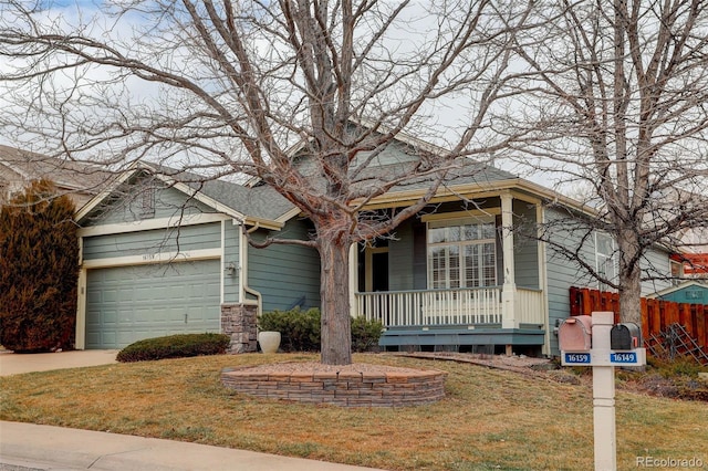 view of front of house featuring a garage, concrete driveway, a porch, fence, and a front lawn