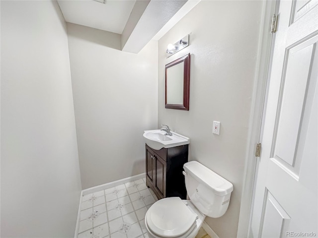 9806 Hooker Ct, Westminster, CO 80031 - half bath featuring baseboards, vanity, toilet, and marble look tile flooring