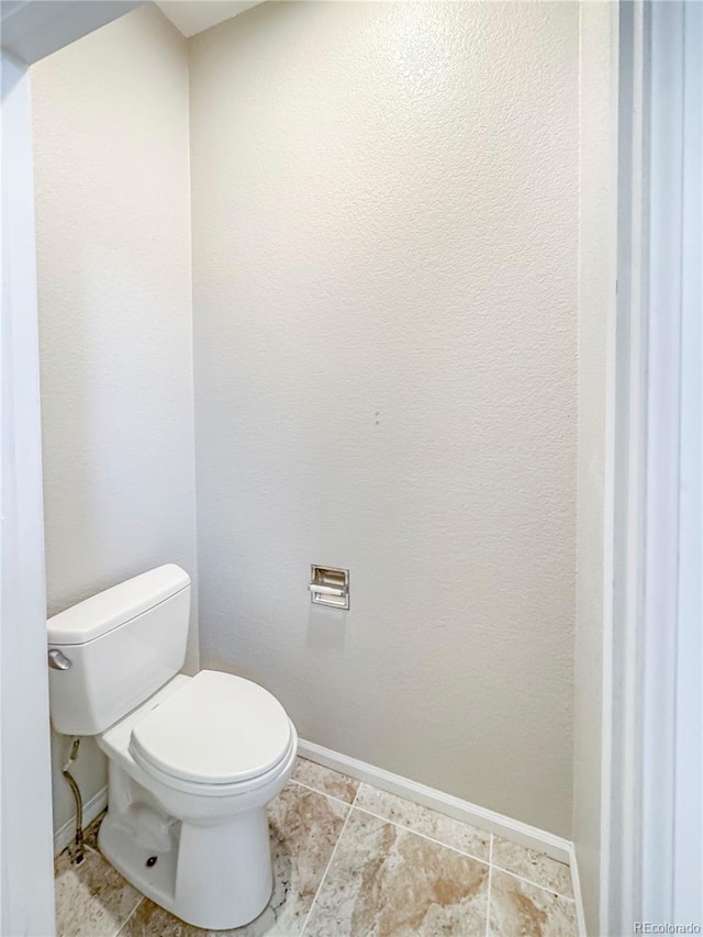 9806 Hooker Ct, Westminster, CO 80031 - bathroom featuring toilet and baseboards