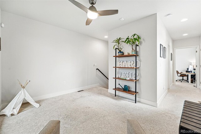 interior space with recessed lighting, carpet flooring, baseboards, and an upstairs landing