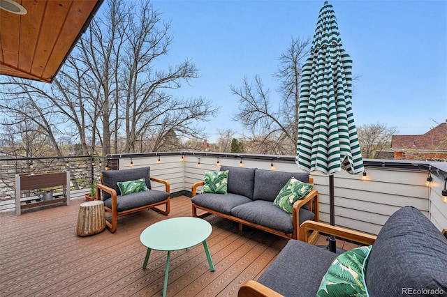 wooden terrace with outdoor lounge area