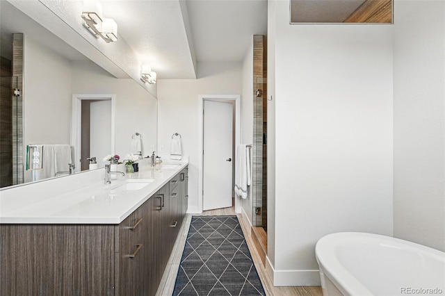 3201 W 25th Ave, Denver, CO 80211 - full bath with a freestanding bath, double vanity, a shower stall, and tile patterned floors