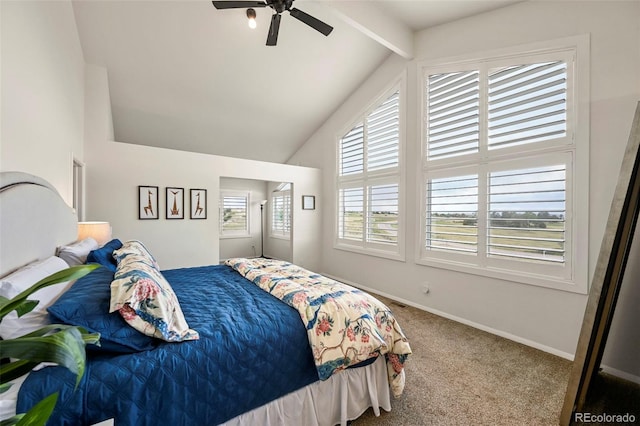 bedroom with ceiling fan, lofted ceiling with beams, and carpet floors