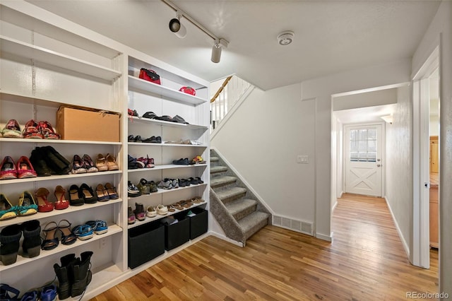 walk in closet featuring light hardwood / wood-style floors