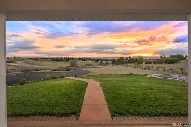 view of yard at dusk