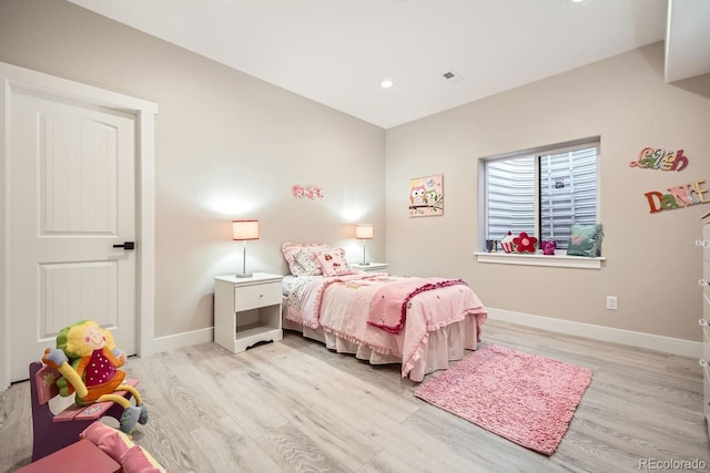 bedroom with light hardwood / wood-style flooring