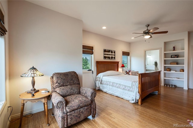 15910 Rhodes Pl, Elbert, CO 80106 - bedroom with wood finished floors, recessed lighting, ensuite bathroom, ceiling fan, and baseboards