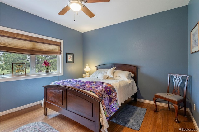 15910 Rhodes Pl, Elbert, CO 80106 - bedroom with baseboards, wood finished floors, and ceiling fan