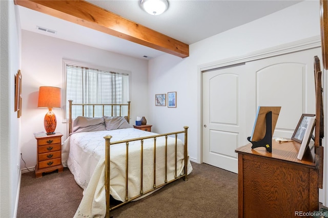 15910 Rhodes Pl, Elbert, CO 80106 - bedroom with dark carpet, beam ceiling, and a closet