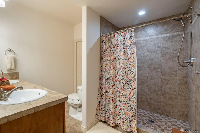 15910 Rhodes Pl, Elbert, CO 80106 - bathroom with a tile shower, vanity, toilet, and recessed lighting