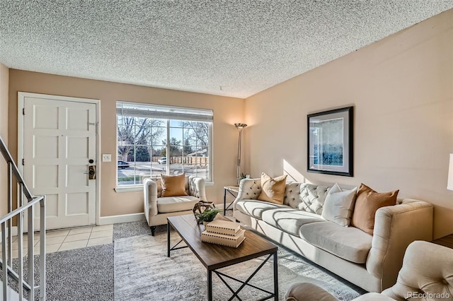 living room featuring light tile patterned floors and a textured ceiling