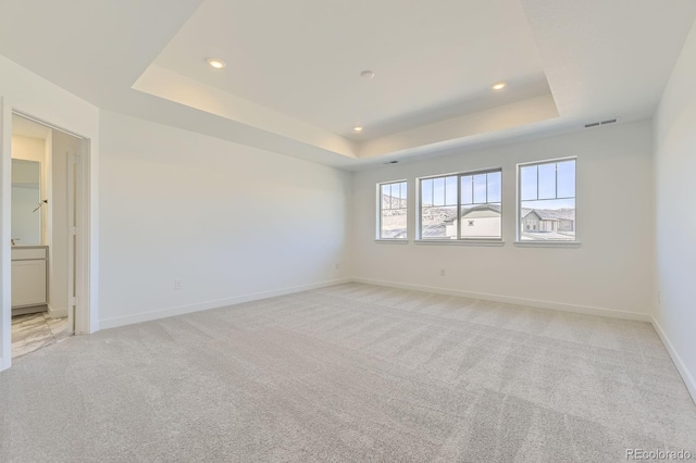 2968 S Poppy St, Morrison, CO 80465 - unfurnished room with baseboards, light carpet, recessed lighting, visible vents, and a tray ceiling