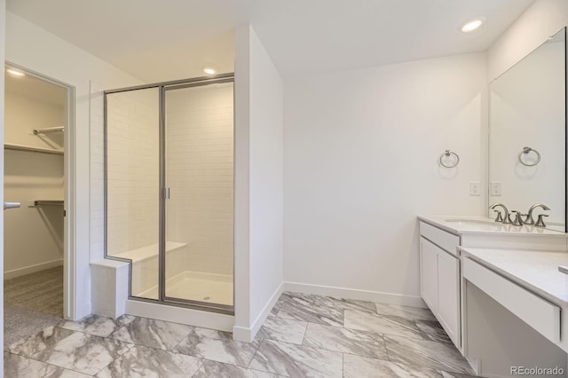 2968 S Poppy St, Morrison, CO 80465 - full bathroom with a stall shower, marble finish floor, baseboards, and vanity