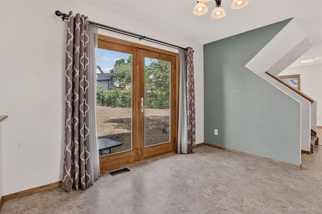 10181 Detroit Ct, Thornton, CO 80229 - entryway with a chandelier, stairs, and french doors