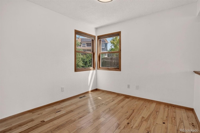 10181 Detroit Ct, Thornton, CO 80229 - unfurnished room featuring light wood-style flooring and a textured ceiling