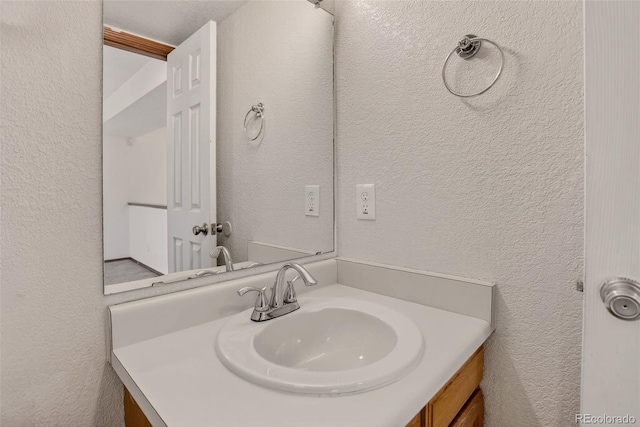 10181 Detroit Ct, Thornton, CO 80229 - bathroom featuring a textured wall and vanity