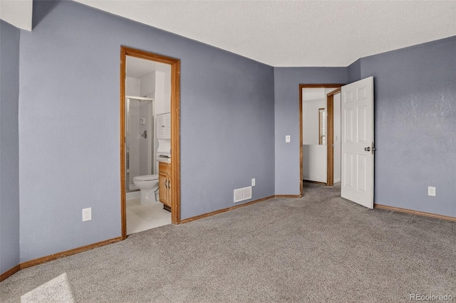 10181 Detroit Ct, Thornton, CO 80229 - unfurnished bedroom featuring carpet flooring, a textured ceiling, and connected bathroom