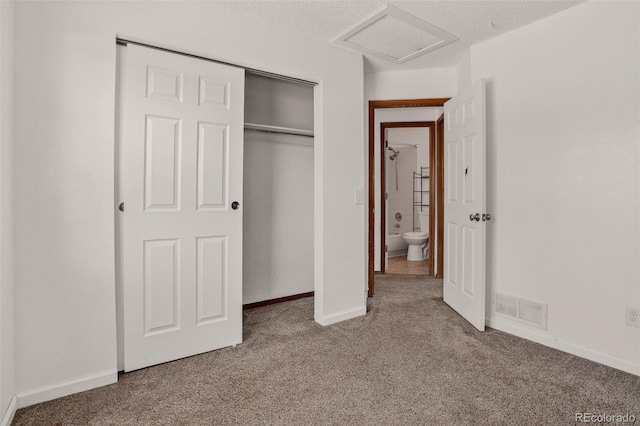 10181 Detroit Ct, Thornton, CO 80229 - unfurnished bedroom with carpet, attic access, a closet, and a textured ceiling