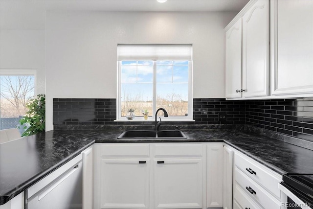 kitchen featuring plenty of natural light, white cabinetry, a sink, and dishwasher