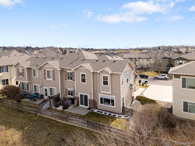 birds eye view of property with a residential view