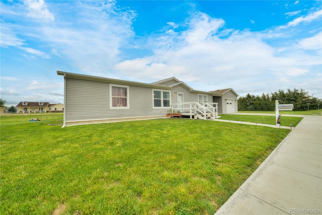 539 W 9th St, Akron, CO 80720 - ranch-style house with a garage, a front lawn, and concrete driveway