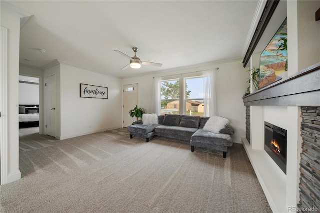539 W 9th St, Akron, CO 80720 - carpeted living area featuring a glass covered fireplace, ceiling fan, and ornamental molding